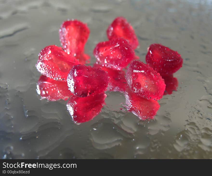 Reflection Of Grains Of A Pomegranate In A Mirror-