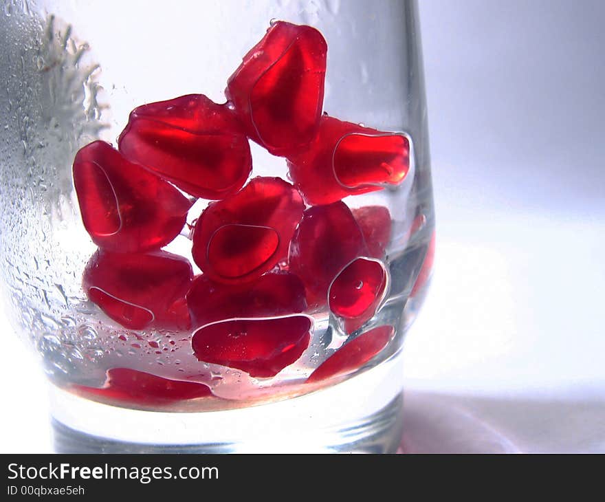 Grains Of A Pomegranate In A Transparent Glass