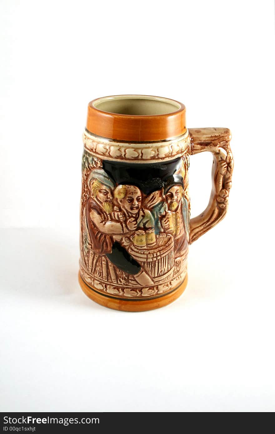 Vintage ceramic beer mug, decorated by bas-relief. Vintage ceramic beer mug, decorated by bas-relief