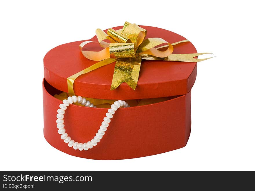 Heart shape box with pearl necklace and gold ribbon. Heart shape box with pearl necklace and gold ribbon