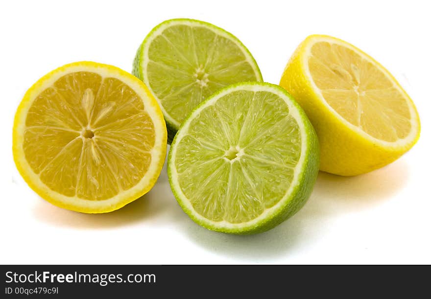 Halved lemon and lime isolated on white background. Halved lemon and lime isolated on white background.