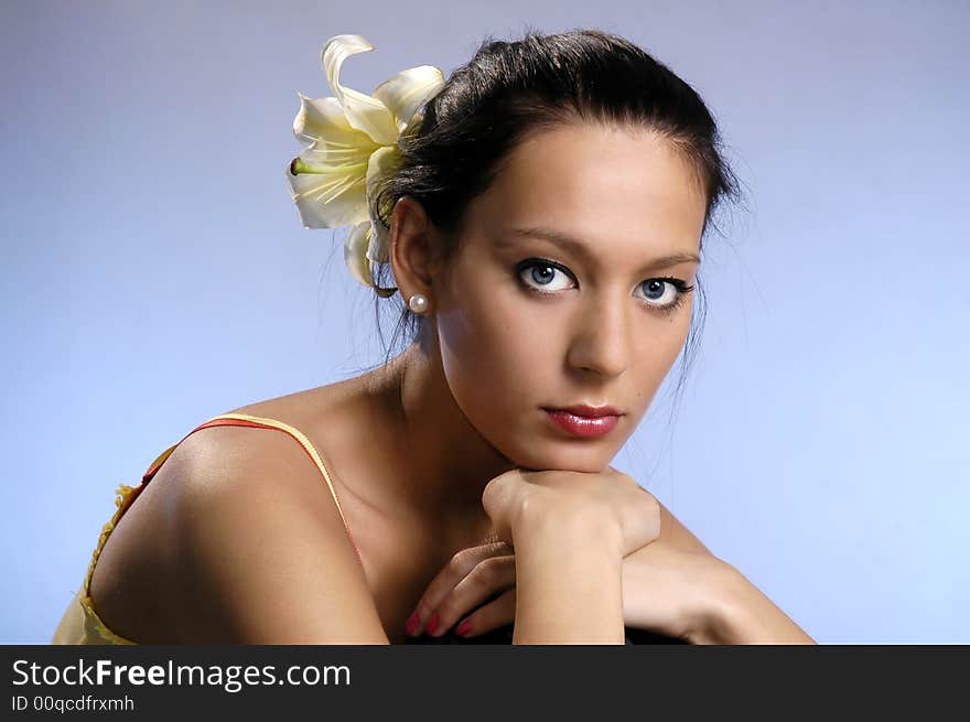 The beautiful girl on a dark blue background