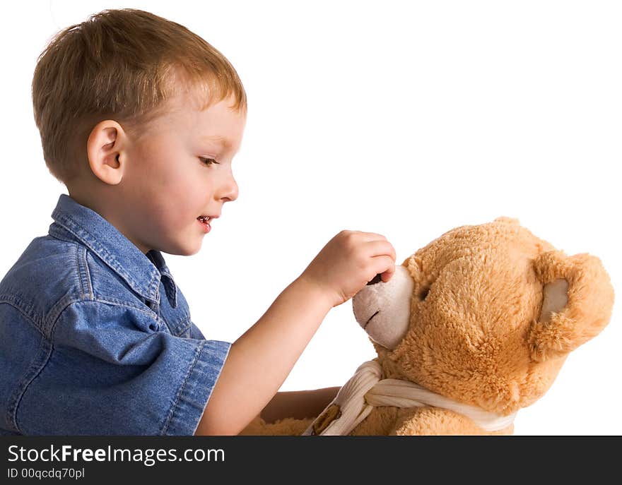 Little boy embraces a teddy bear. Little boy embraces a teddy bear