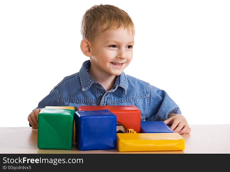 Child plays with colour blocks. Child plays with colour blocks