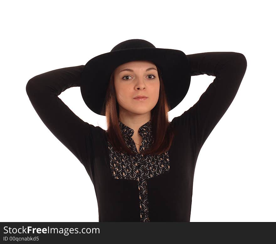 Portrait of the girl in a black hat. Isolated