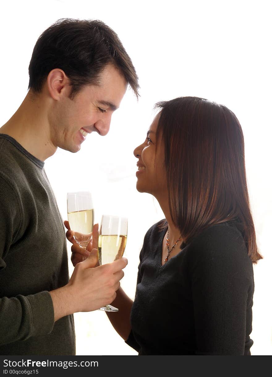 Young man and woman celebrate their engagement with champagne. Young man and woman celebrate their engagement with champagne.