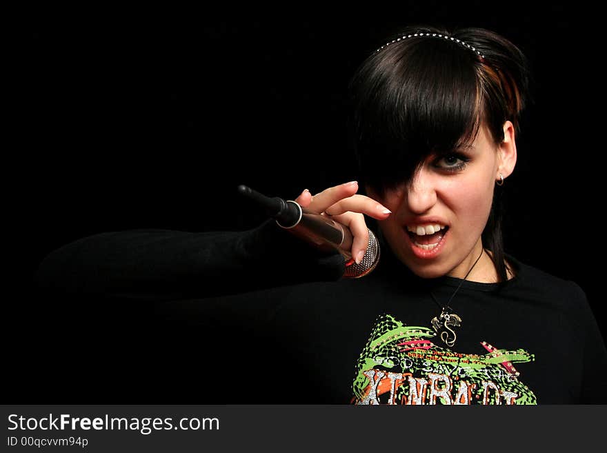 Young singer, on black background