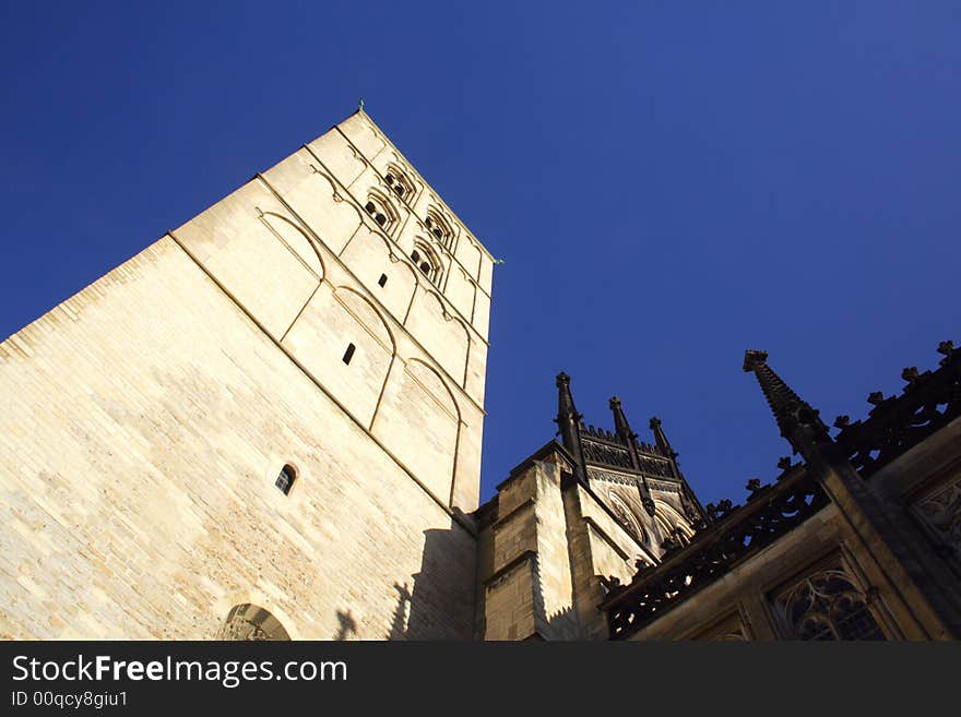 Church in Munster, Germany from below with blue sky