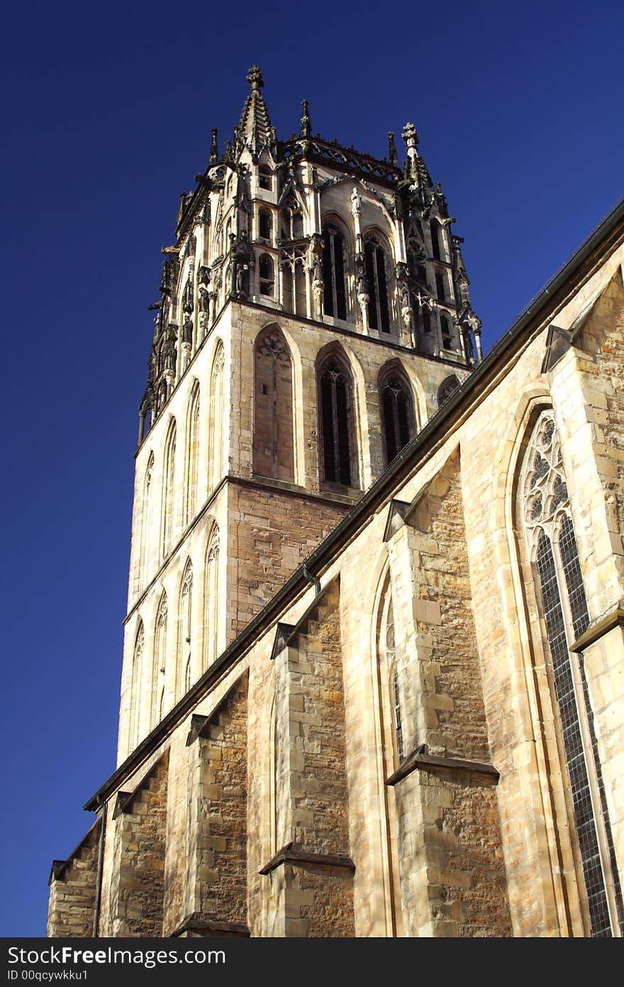 Church in Munster, Germany from below with blue sky