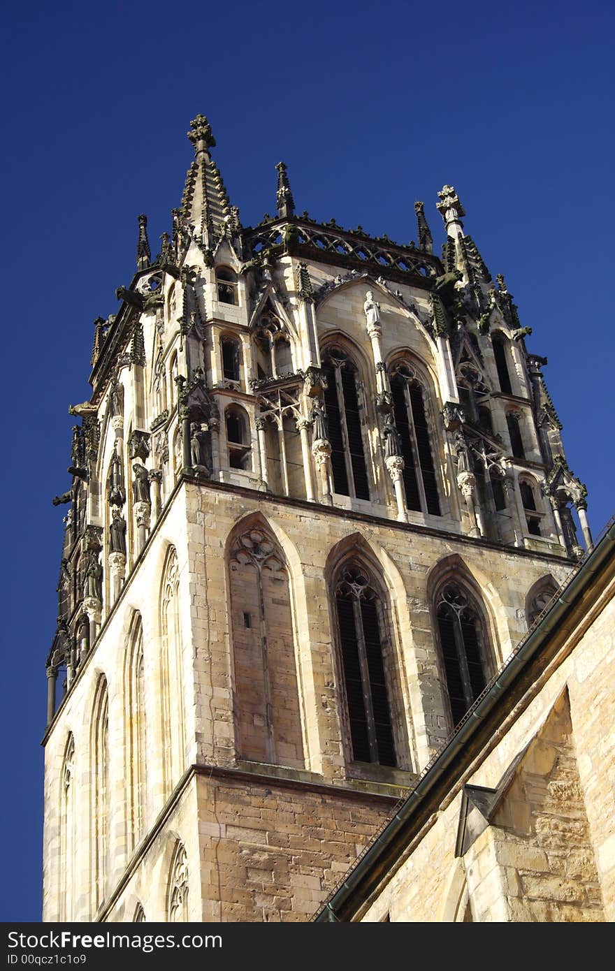 Church in Munster, Germany from below with blue sky