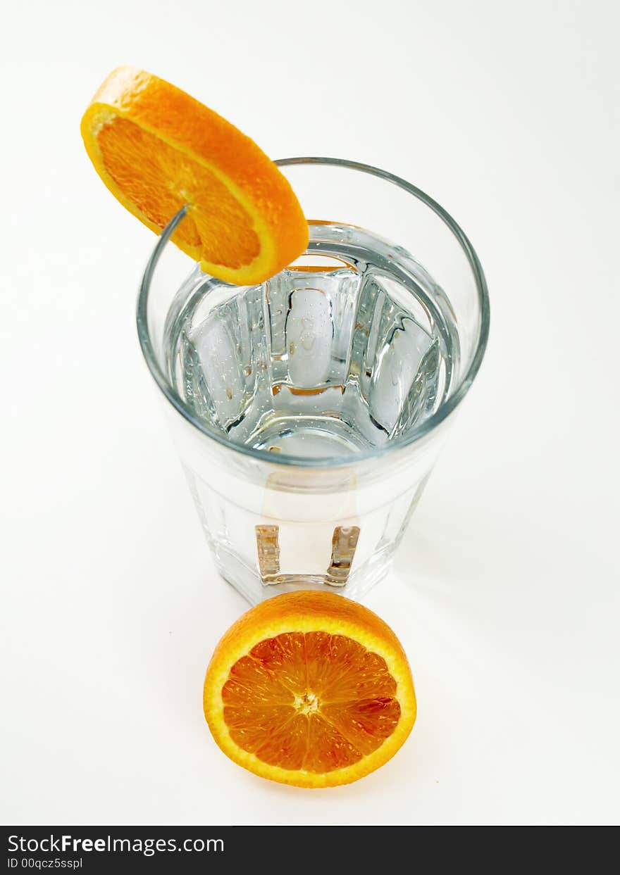 Glass of pure water with orange slices. Glass of pure water with orange slices