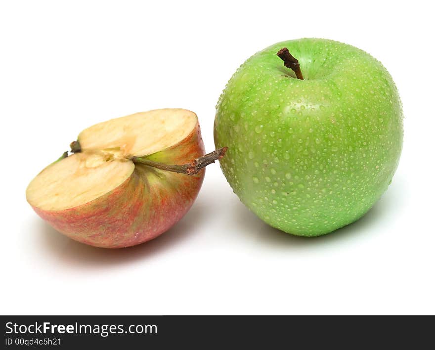 The whole green and half of red apple on white. Isolation on white. Shallow DOF. The whole green and half of red apple on white. Isolation on white. Shallow DOF.