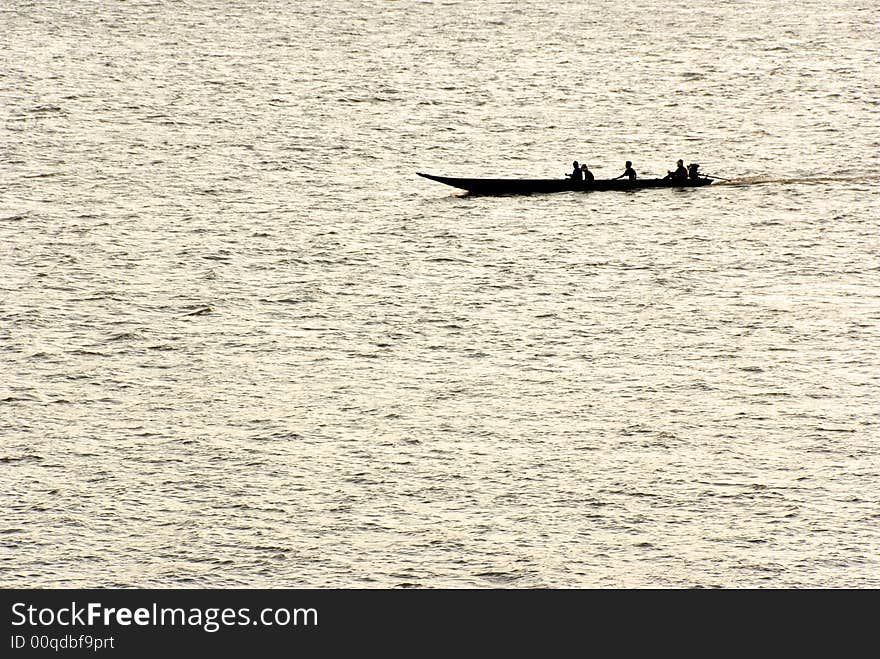 Small boat silhouette on a river. Small boat silhouette on a river