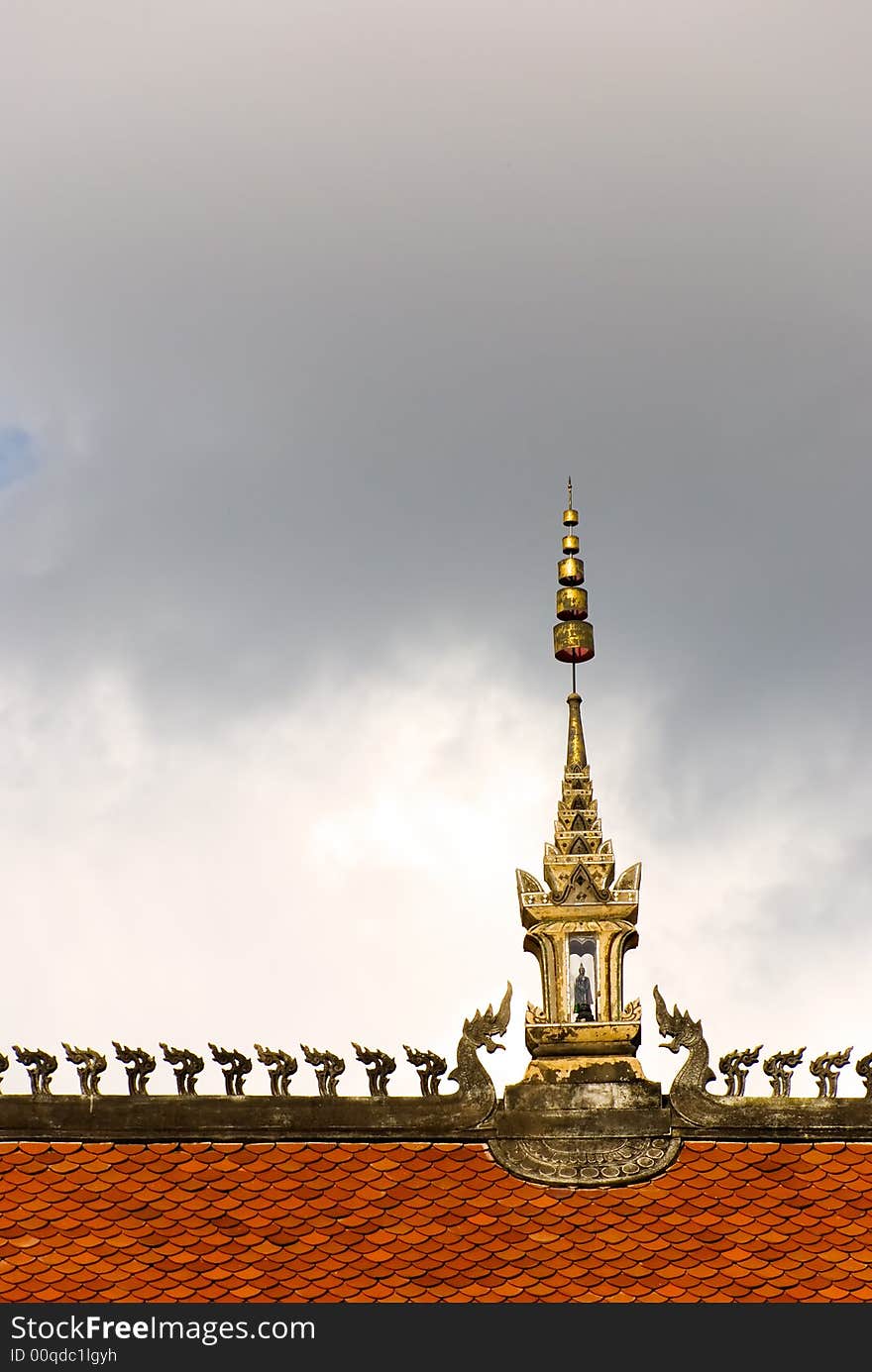 Buddhist temple roof with decoration and dark sky