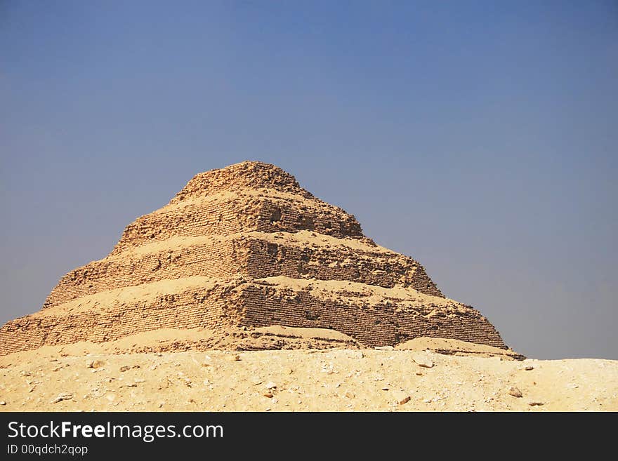 Ancient step pyramid of Djoser (Zoser) at Saqqara plateau, Egypt, near Cairo. Ancient step pyramid of Djoser (Zoser) at Saqqara plateau, Egypt, near Cairo