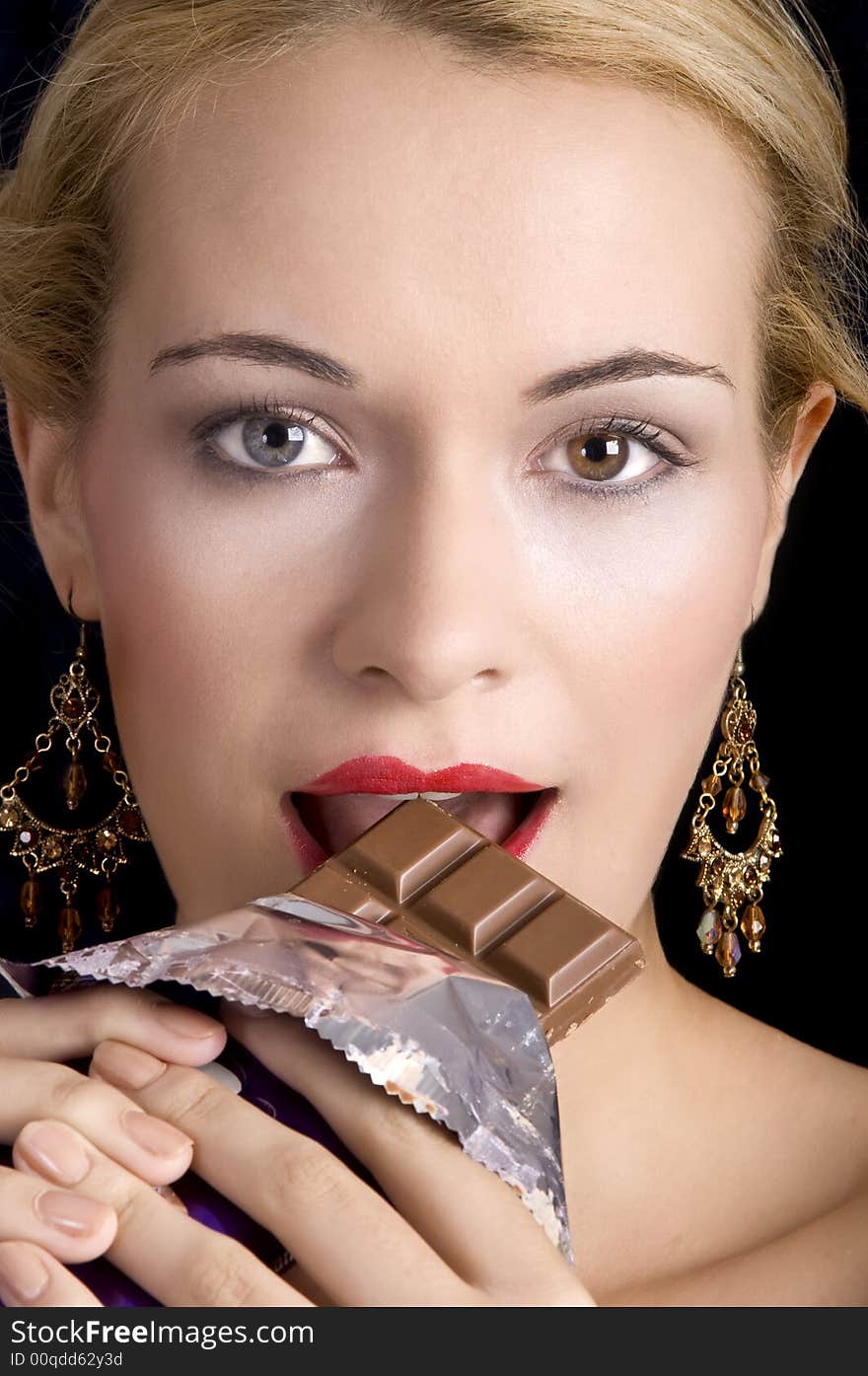 Beautiful Woman Eating Chocolate