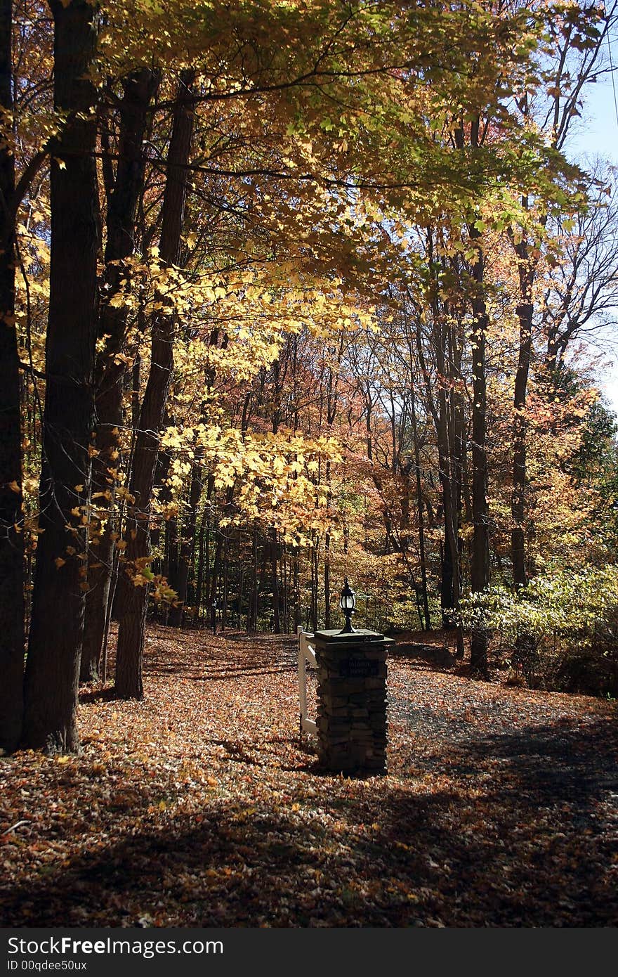 Entrance to an estate during the fall season. Entrance to an estate during the fall season