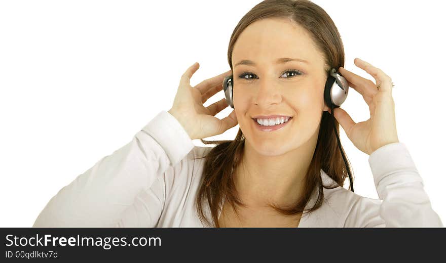 Caucasian girl wearing headset and holding it while smiling and looking at camera. Caucasian girl wearing headset and holding it while smiling and looking at camera