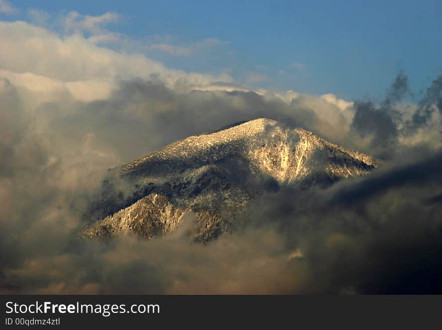 San bernardino peak covered with snow and clouds. San bernardino peak covered with snow and clouds