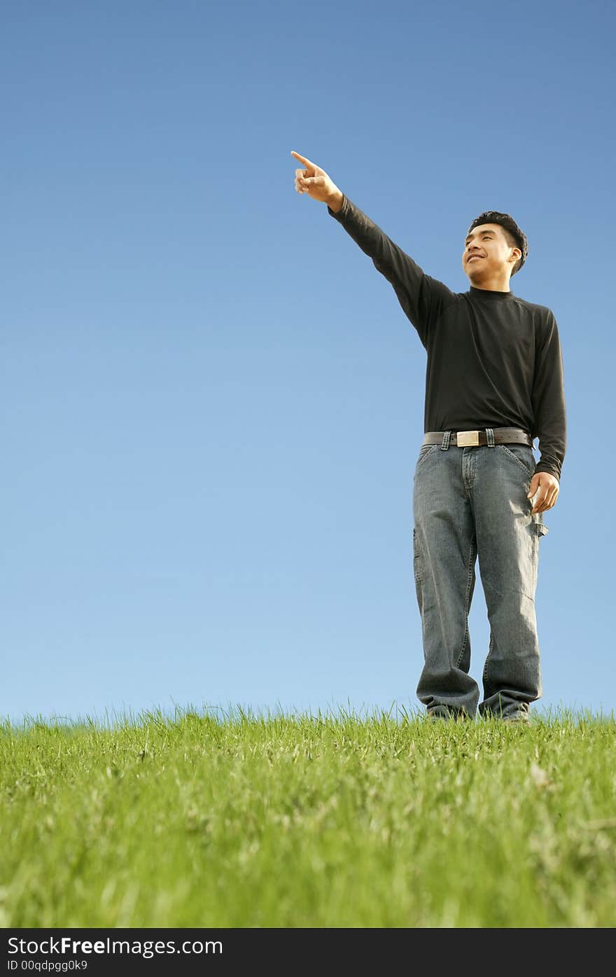 Shot of a man pointing out representing pointing at future target or goal. with copyspace. Shot of a man pointing out representing pointing at future target or goal. with copyspace