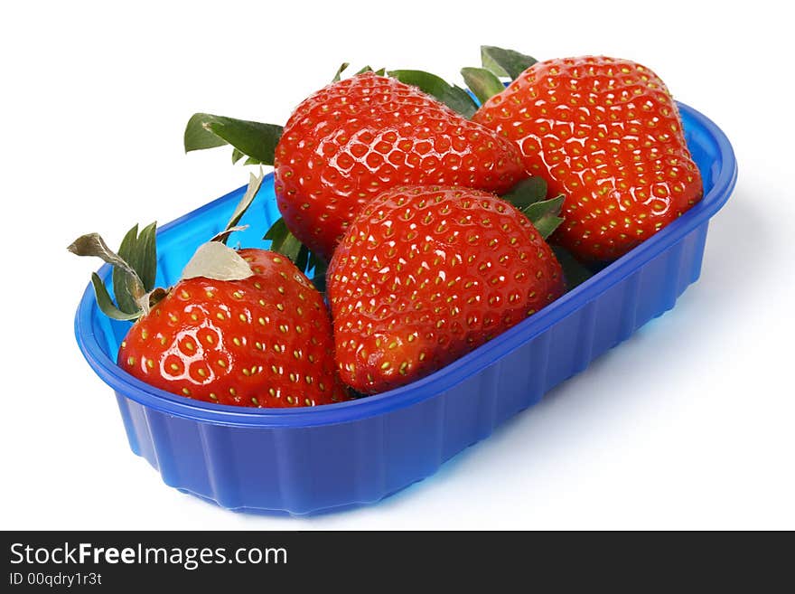 Strawberry in blue bowl isolated on white. Strawberry in blue bowl isolated on white