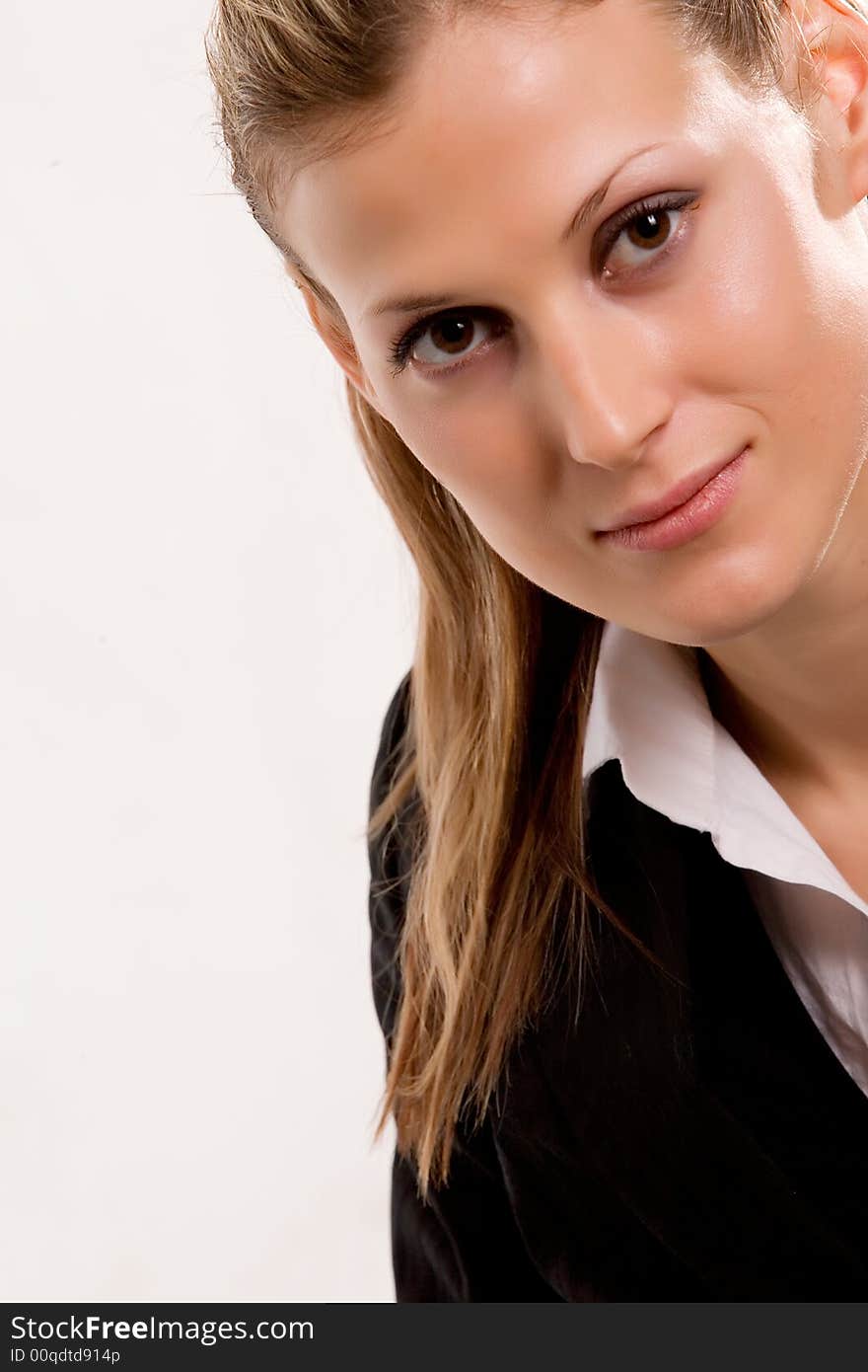 Natural blonde woman in formal wear close-up portrait