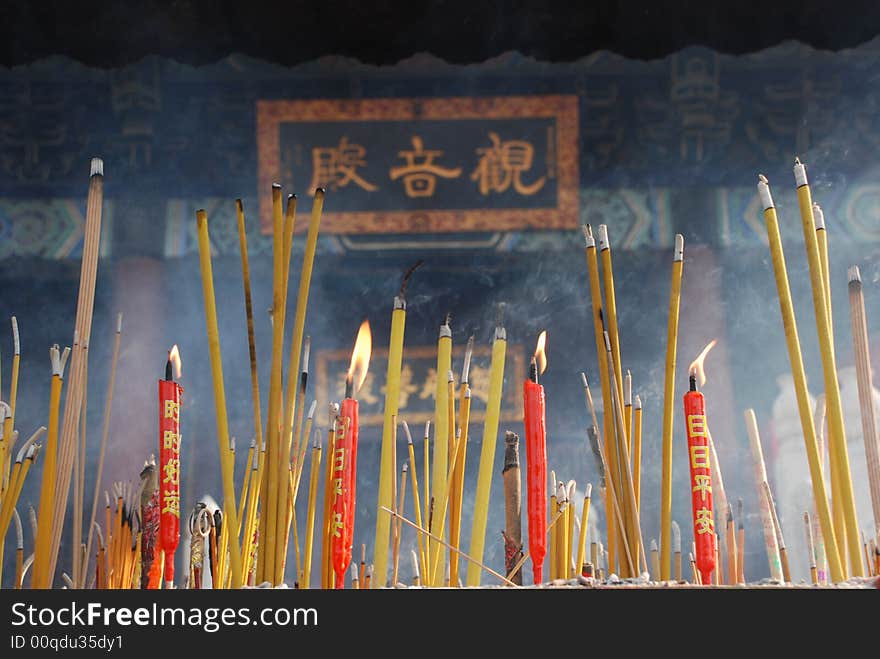 Joss sticks and candles burning at a temple. Joss sticks and candles burning at a temple