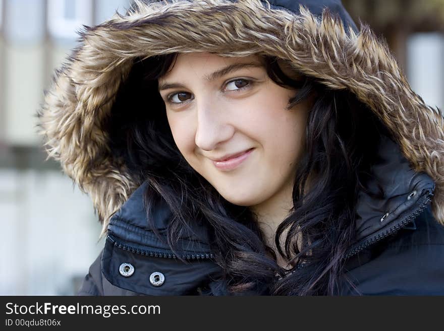 Smiling girl in autumn fashion