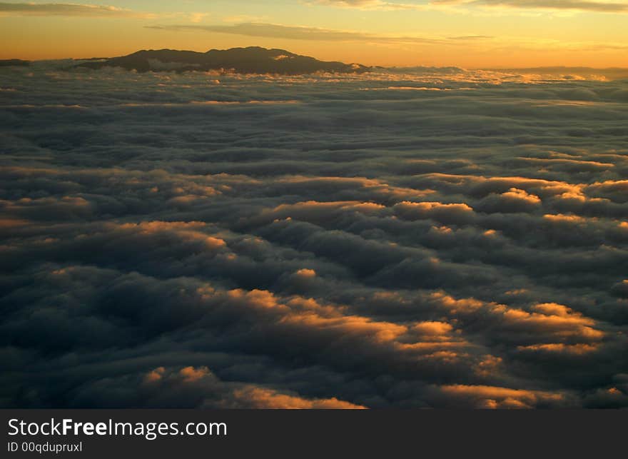 Mountains at sunrise with clouds