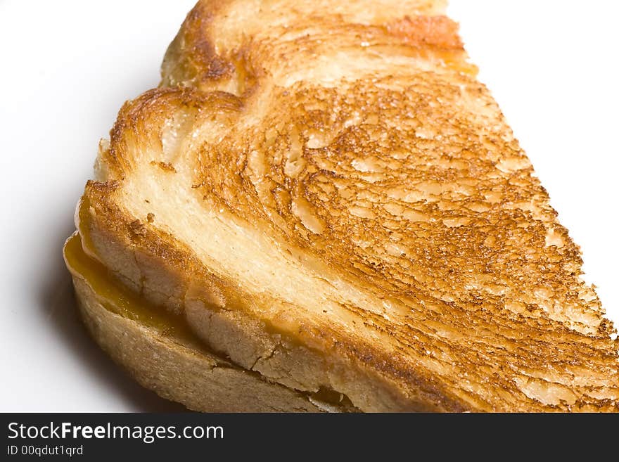 Grilled cheese sandwich on a white plate shot with a macro lens. Grilled cheese sandwich on a white plate shot with a macro lens