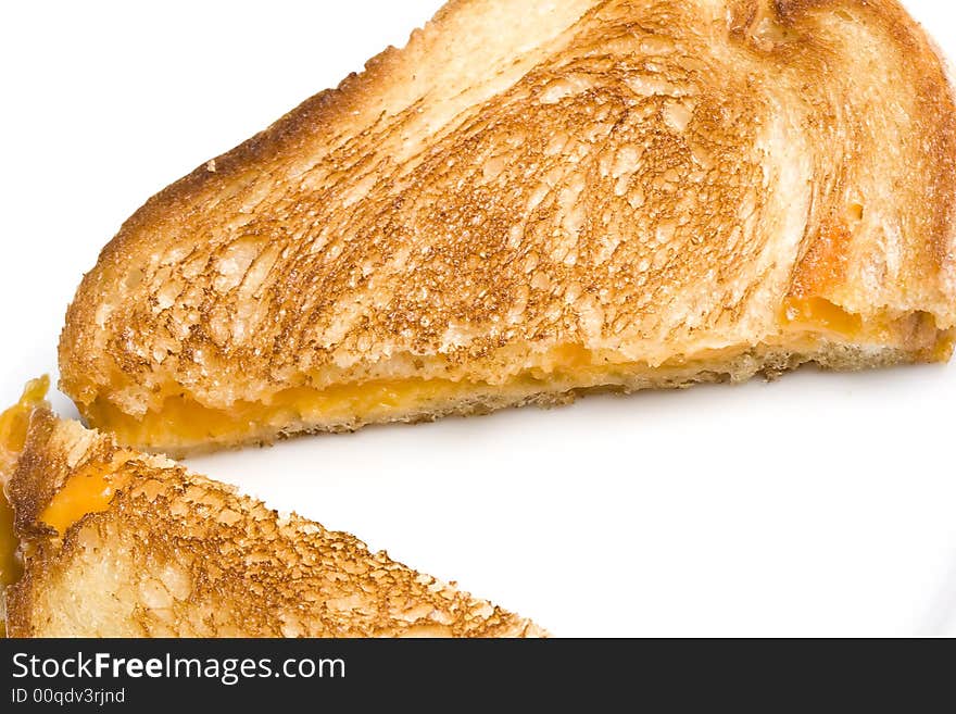 Grilled cheese sandwich on a white plate shot with a macro lens. Grilled cheese sandwich on a white plate shot with a macro lens