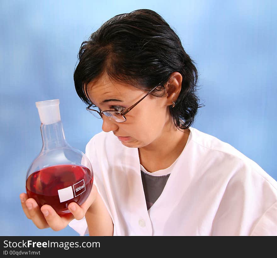 The girl with a flask on a blue background