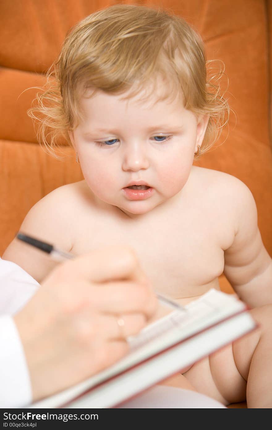 Doctor pediatrician write receipt for little patient. Doctor pediatrician write receipt for little patient