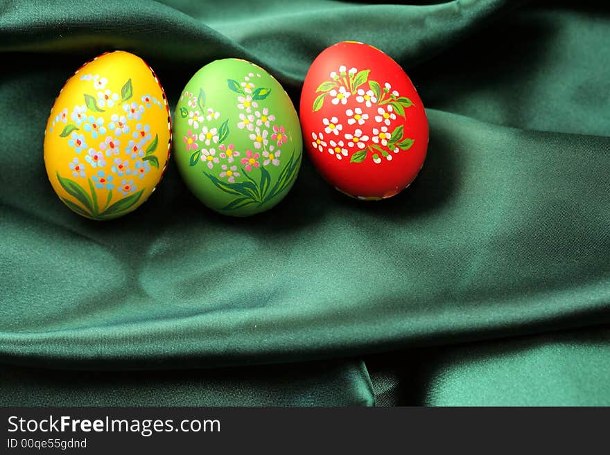 Easter Eggs on Green Satin Fabric