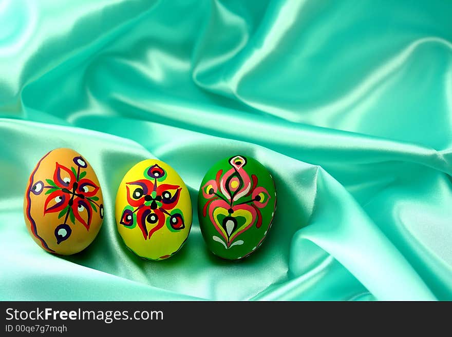 Ornamental Easter Eggs on Turquoise Satin