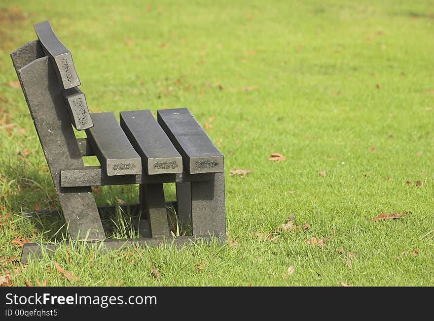 Wooden bench in a park in Holland in late winter. Wooden bench in a park in Holland in late winter