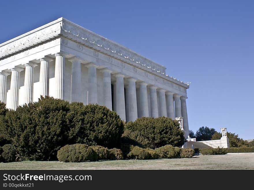 Lincoln memorial captured at a low angle on sunny day.