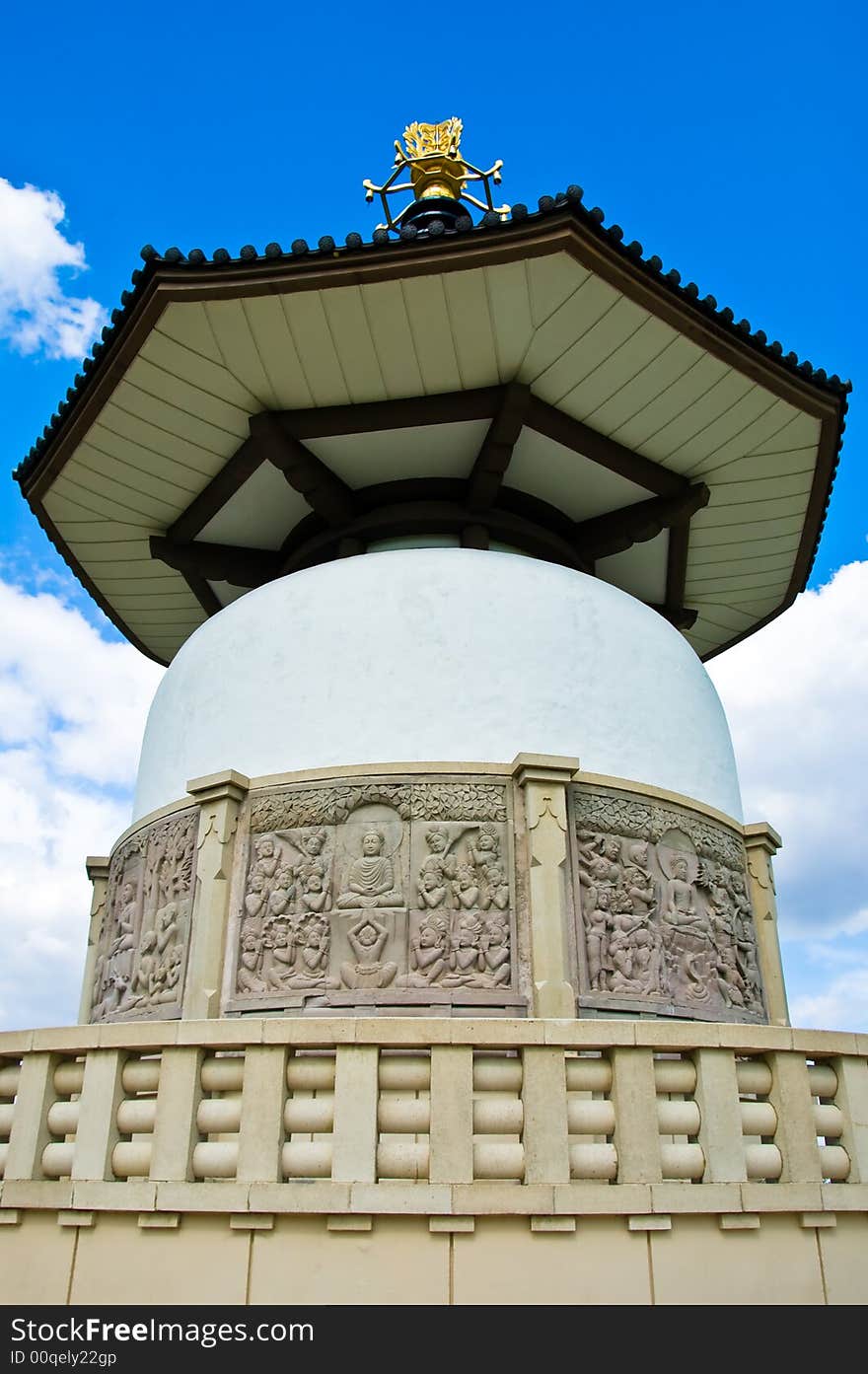 Buddhist peace pagoda against a blue sky