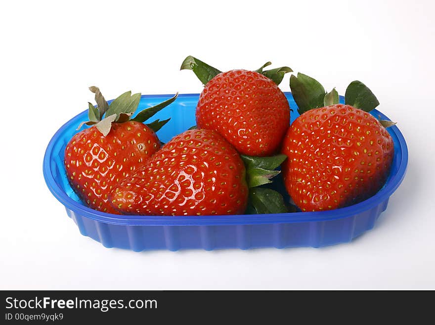 Sweet strawberries in bowl closeup