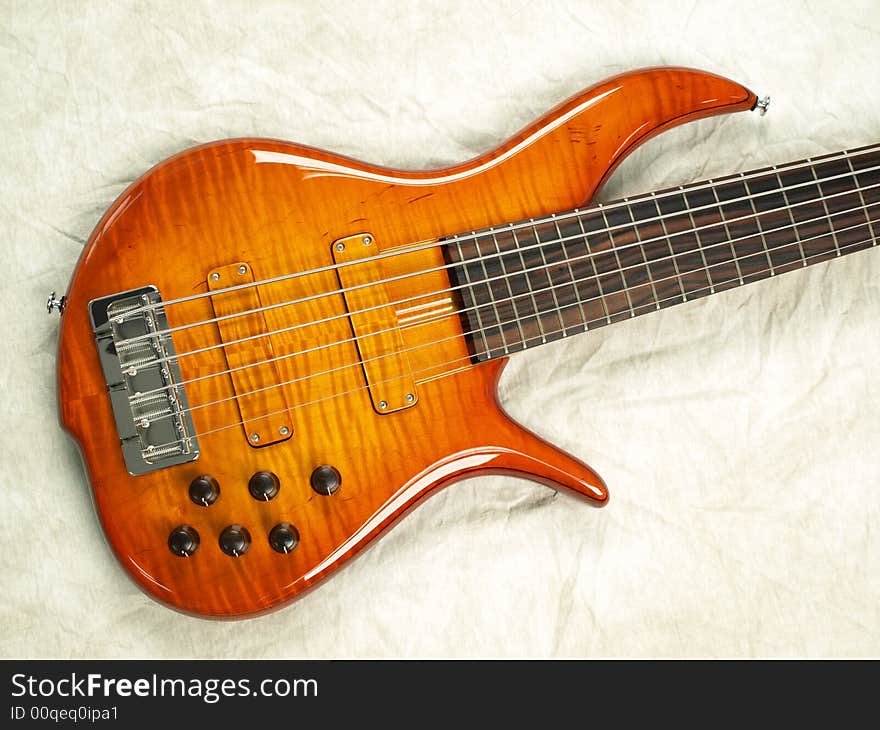 Wood Bass Guitar with body, neck and strings. Wood Bass Guitar with body, neck and strings