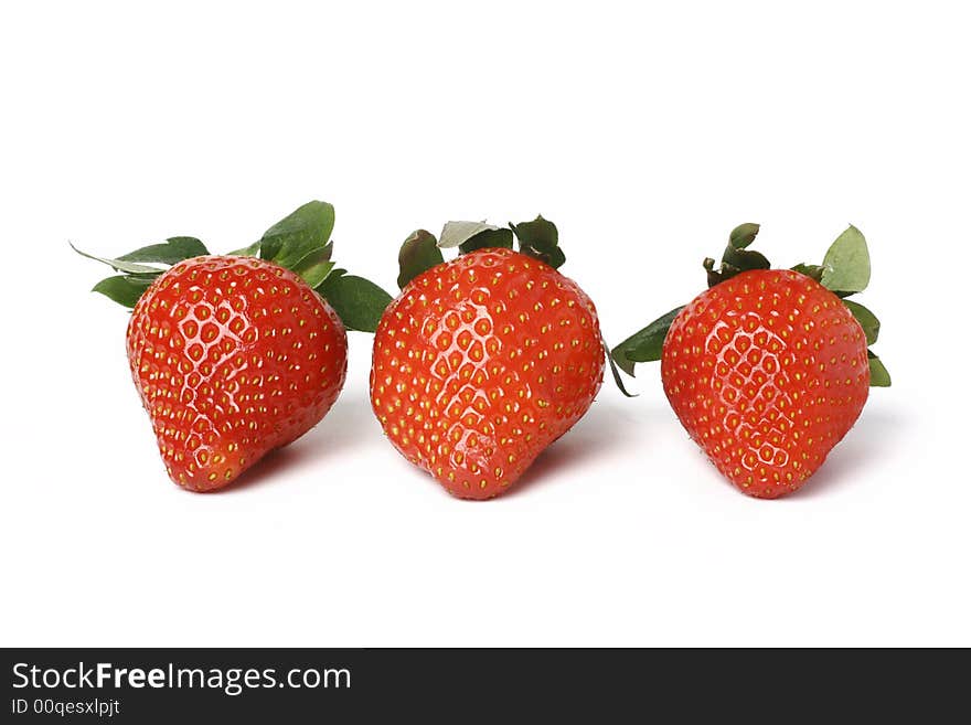 Three strawberries isolated on wnite