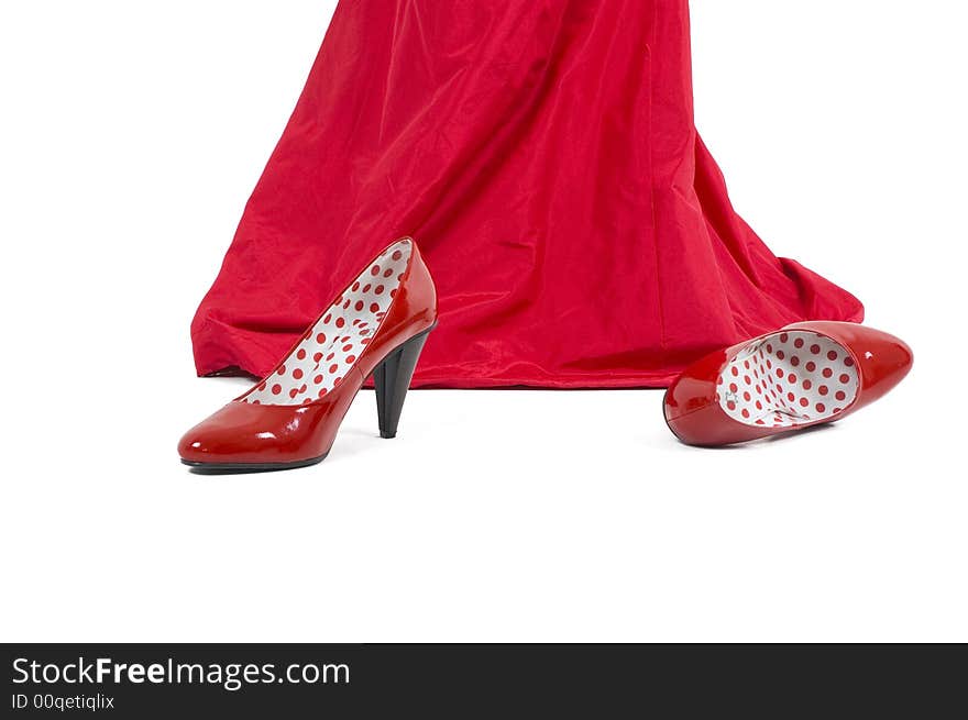 Shiny red high hill shoes.Girl in red with red shoes.