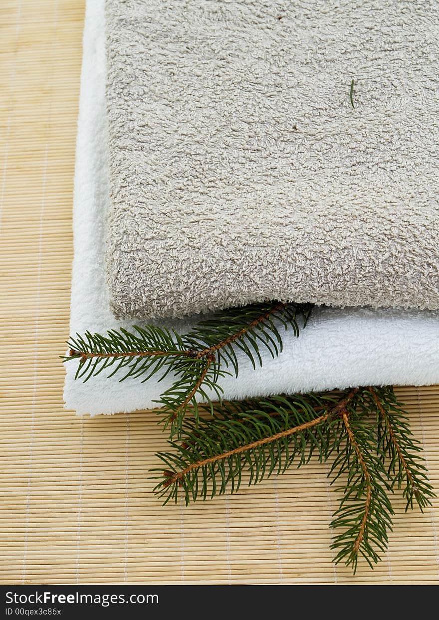 Towels on wooden background with pine branches. Towels on wooden background with pine branches