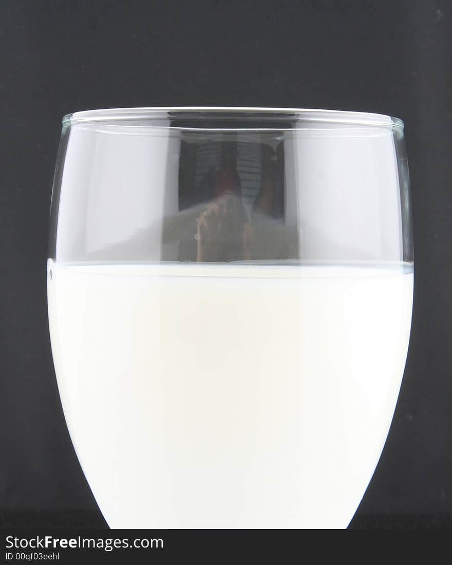 Milk in a shiny glass very healthy and full of calcium. Milk in a shiny glass very healthy and full of calcium