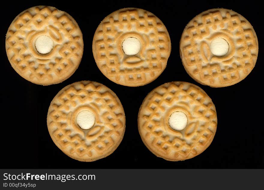 Five cookies on black background mimic olimpic rings