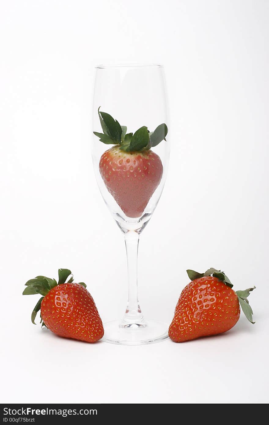 Three strawberry and glass on white. Three strawberry and glass on white