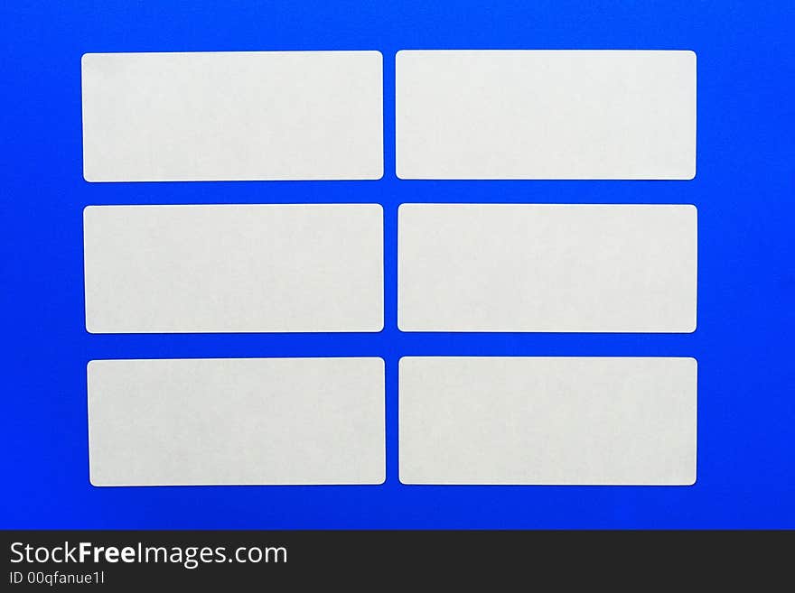 White cards on a blue background.White paper.