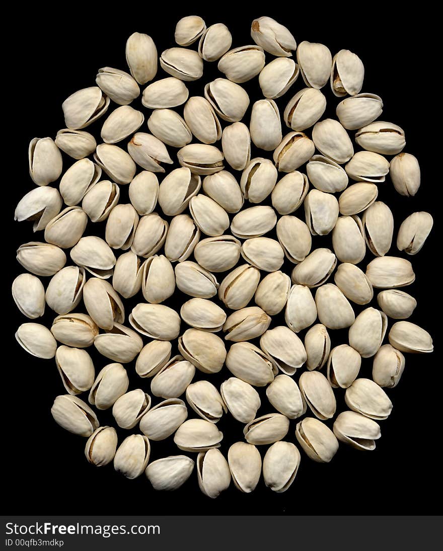 Bounch of dry pistachios on black background