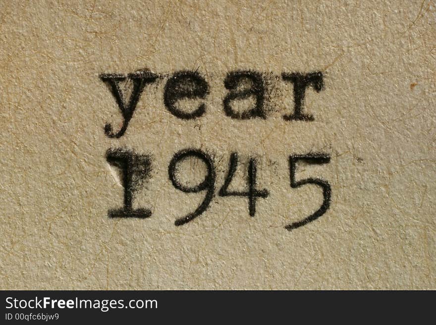 Year 1945 written with an old typewriter on an aged paper.