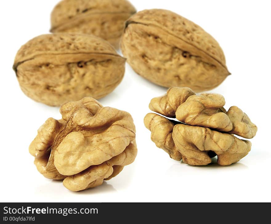 Walnuts in closeup with white background.